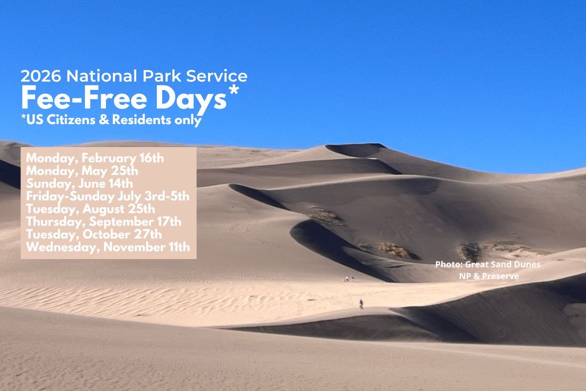 View of giant sand dunes against a blue sky
